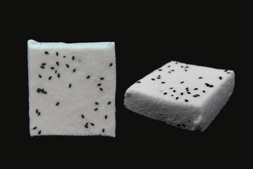 Chinese snack with black background. Dessert is white and auspicious snack. Kind of Chinese pancake made of rice-flour.