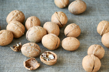 Walnuts on a brown textile background 