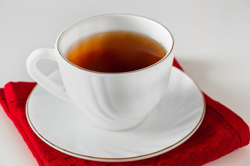 White cup for coffee on a saucer