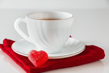 Obraz na płótnie Canvas Tea in a white cup on a white background.