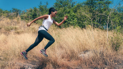 Fototapeta na wymiar african american woman having exerice with trail running at natural mountain