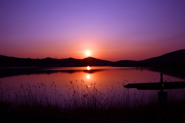 Beautiful view of the alpine lake under the Fuji mountain in Japan in the early morning sun