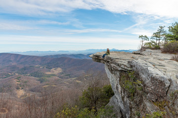 Fototapeta premium Young woman on the observation point on McAfee Knob