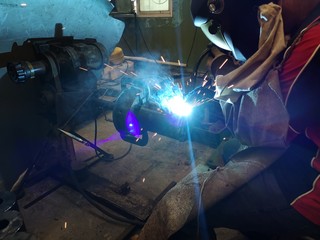 Workers are welding the work urgently.