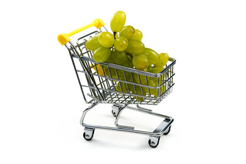 A grape in shopping cart isolated on white background. Ripe tasty green grapes in shopping cart....