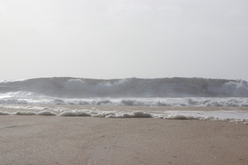 Big wave on the beach in Nazare