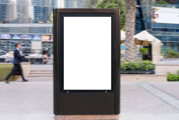 Outdoor Information board with trees, grass and pavement as background. This light box is ideal for advertisement mock up