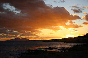 Fototapeta na wymiar Sunset with mountain view and sea