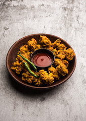 Crispy Corn pakora/pakoda, bhajji, Bhaji, bajji or pattice . served with tomato ketchup
