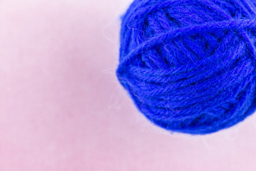 yarn color blue on pink background.