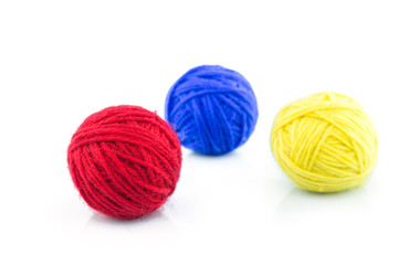 yarn color red, blue, yellow on white background.