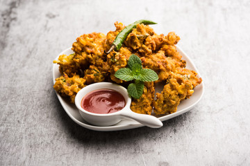 Crispy Corn pakora/pakoda, bhajji, Bhaji, bajji or pattice . served with tomato ketchup