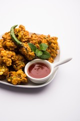 Crispy Corn pakora/pakoda, bhajji, Bhaji, bajji or pattice . served with tomato ketchup