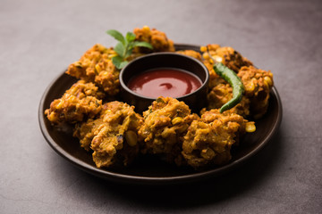 Crispy Corn pakora/pakoda, bhajji, Bhaji, bajji or pattice . served with tomato ketchup