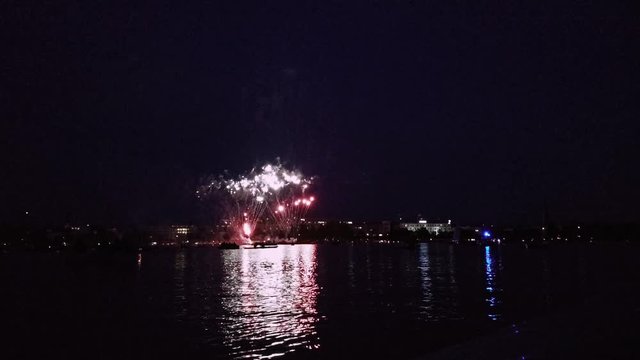 Fire works exploding above the alster lake in the city of Hamburg