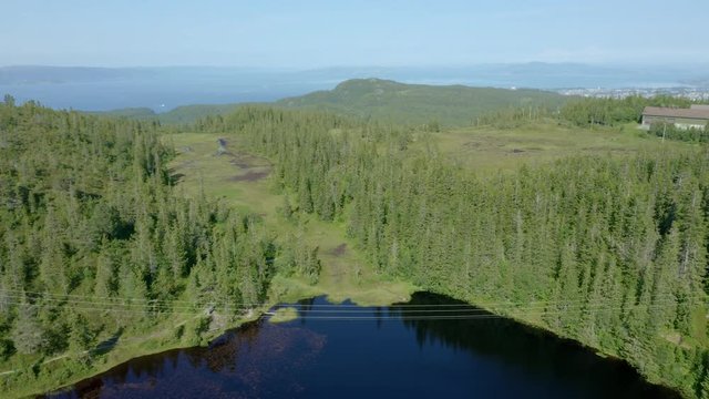 Panorama of pond Baklidammen in nature reserve Bymarka, Trondheim, aerial