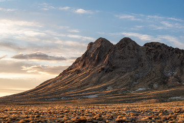 USA, Nevada, Nye County, Tonopah. The southwest face of Mt. Butler (7,116 ft, 2,169 m) at sunset. The peak is named after the founder of the nearby town.