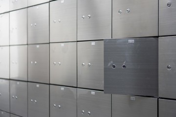 Metal safe box panel wall with open one. Concept for security and banking protection. - obrazy, fototapety, plakaty