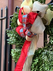 Wreath with greenery and red bow