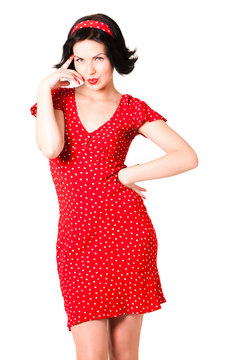 Young woman in red vintage dress standing over white background