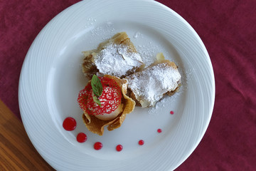 ice cream. strudel and ice cream scoop in a waffle basket