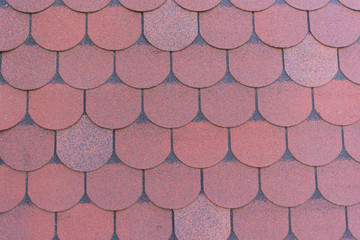 Detailed texture, background. Red bituminous shingles, roofing material
