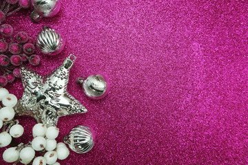 Fototapeta na wymiar Christmas balls composition decoration ornaments with space copy on pink glitter background