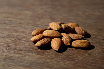 Tasty Almonds on a wooden background