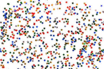 White christmas background. Decorative multi-colored stars. Top view.
