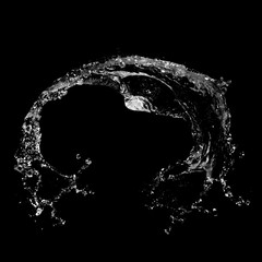 Water splashing isolated over a black background.