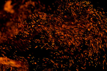 flame of fire with sparks on a black background