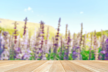 Empty top wooden table on blurred lavender flowers in nature