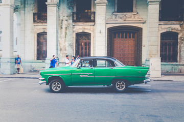 Vintage colored classic american cars in Old Havana, Cuba.