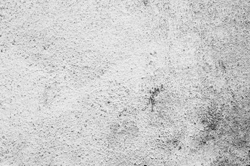 Texture of a concrete wall with cracks and scratches which can be used as a background