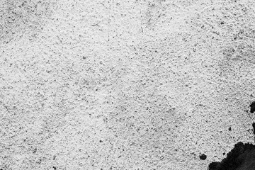 Texture of a concrete wall with cracks and scratches which can be used as a background