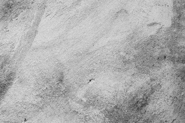 Texture of a concrete wall with cracks and scratches which can be used as a background