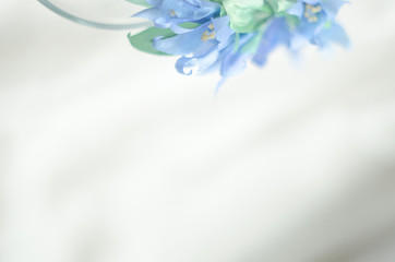 Wedding blue decor with silk ribbon and bride wreath. Copy space. Soft focus
