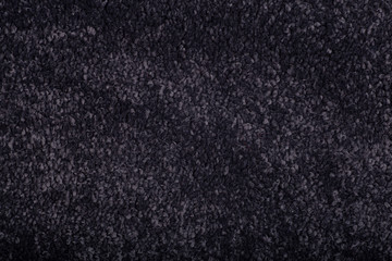 Carpet covering background. Pattern and texture of black carpet. Copy space