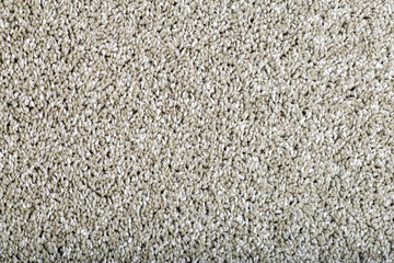 Carpet covering background. Pattern and texture of grey colour carpet. Copy space.