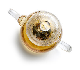 Glass teapot with tea on white background. The view from the top