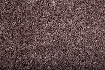 Carpet covering background. Pattern and texture of brown colour carpet. Copy space.