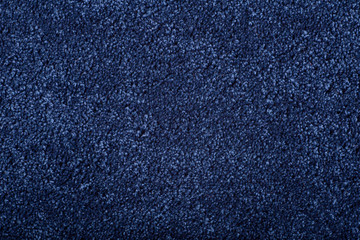 Carpet covering background. Pattern and texture of blue color carpet. Copy space.