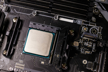 Close-up of a modern computer motherboard with installed cpu. Electronic computer hardware...