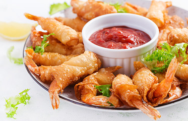 Shrimps with ginger in filo pastry with sweet and sour sauce. Thai cuisine. Deep-fried prawns.