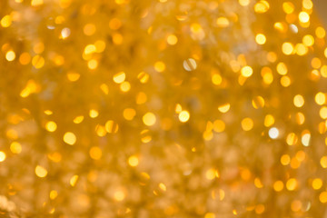 gold color christmas bokeh with defocused lights