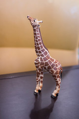 toy figure of a miniature plastic giraffe