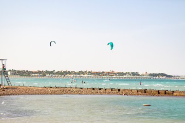 Kite surfers in the Red Sea shallow.