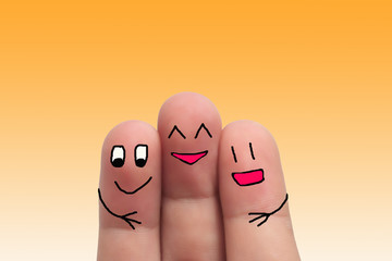 three best friends hands fingers of man and woman on solft yellow background