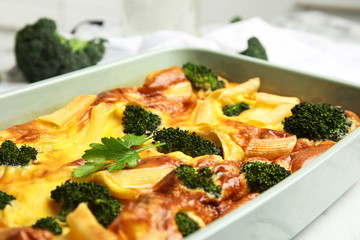 Tasty broccoli casserole in baking dish, closeup