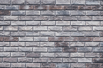 Brown brick wall texture. Gray grunge brickwork. Decorative tile surface. Bricks backgrounds. Messy wall pattern for wallpaper design. Concrete stone background.
